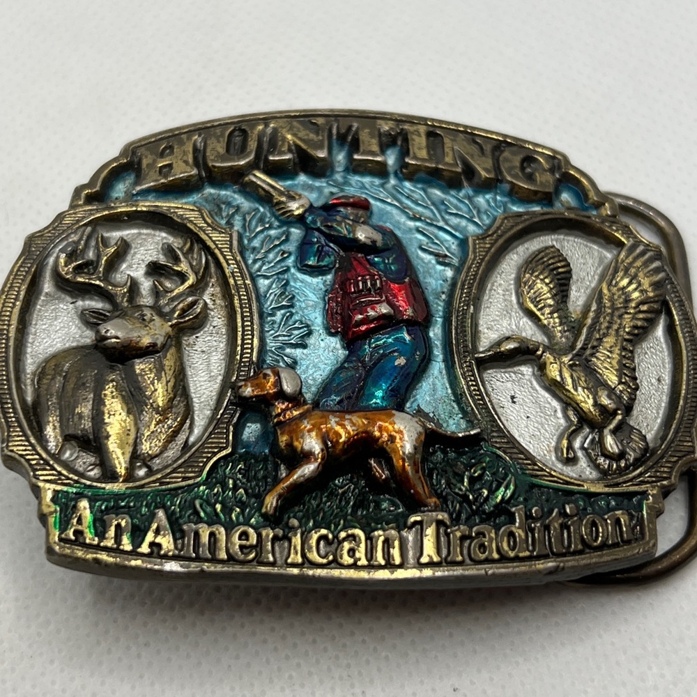 Three vintage belt buckles